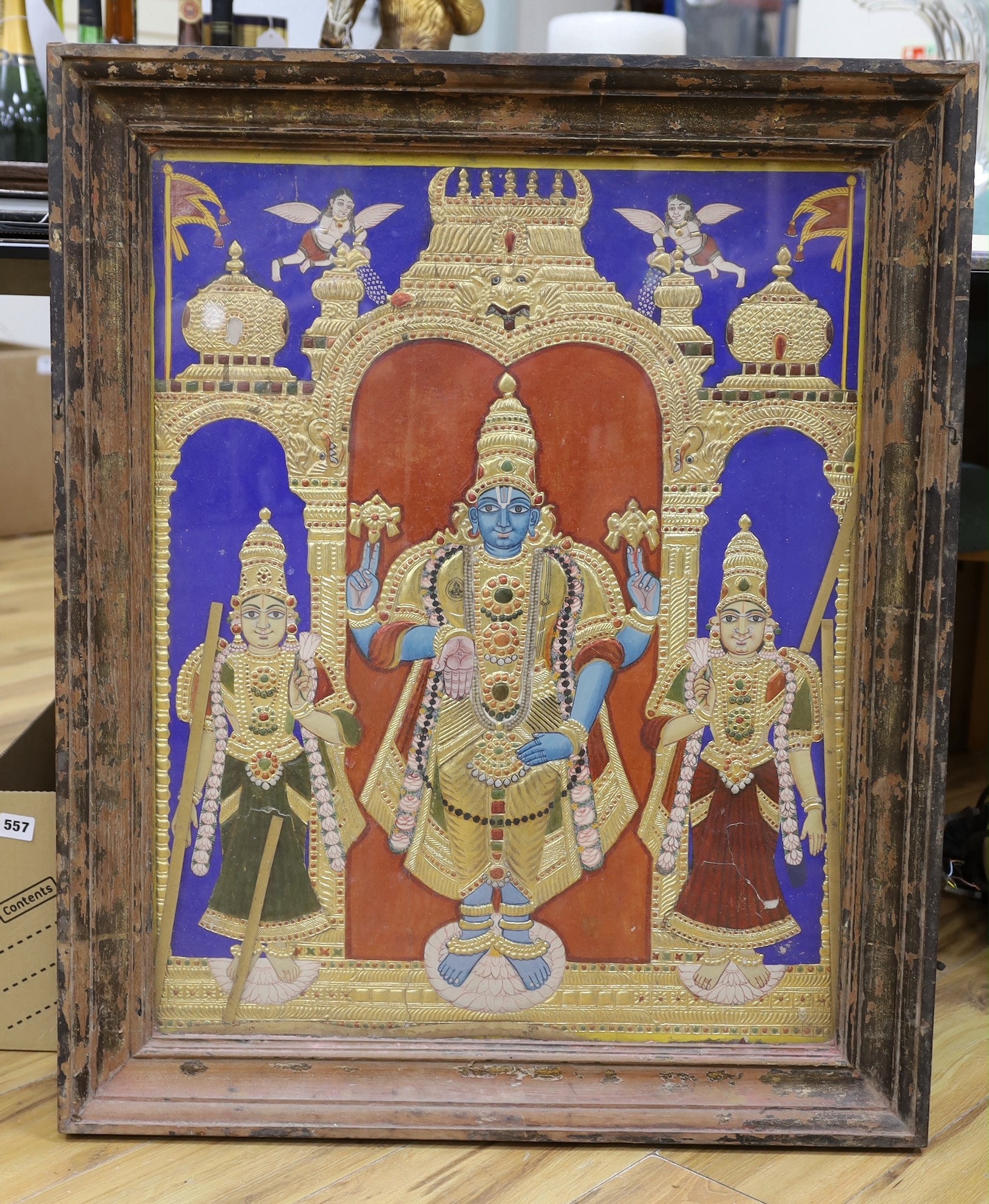 Indian School c.1900, a painted and gilt panel of Shiva with attendants, 74 x 59cm